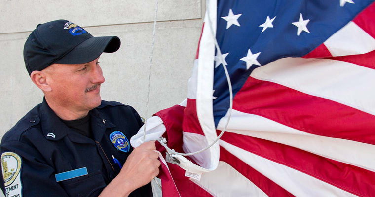 Correctional Officer holding United States flag